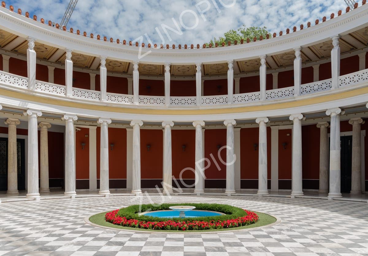 Neoclassical colonnaded courtyard with a flower-ringed fountain