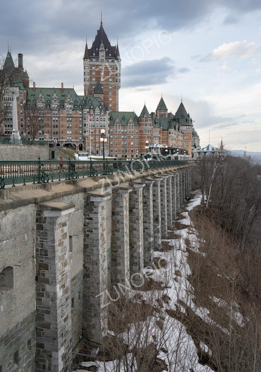 Château Frontenac towering above a stone terrace wall