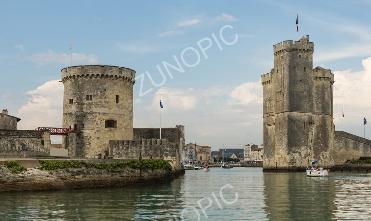 Medieval harbour towers at the entrance to an old port