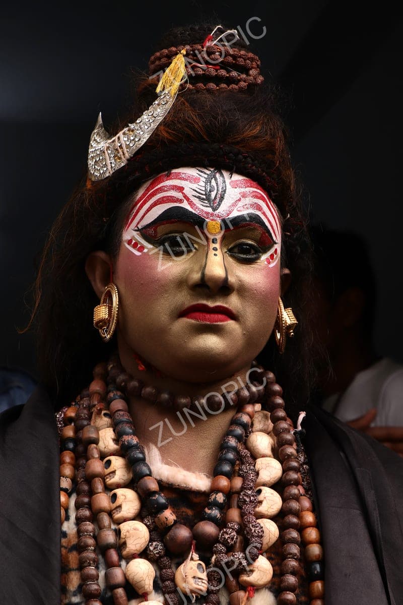 Performer in Shiva makeup and rudraksha beads
