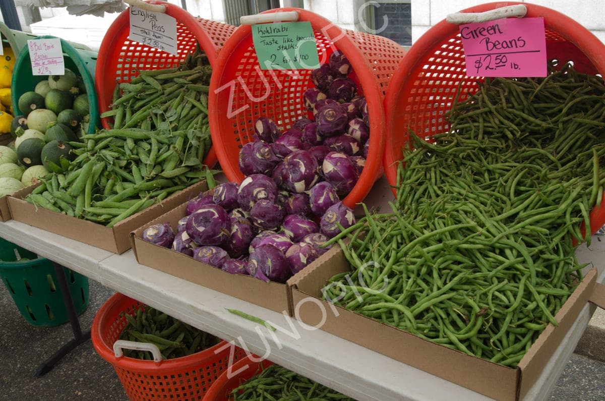 Green beans and kohlrabi at a farmers market stall