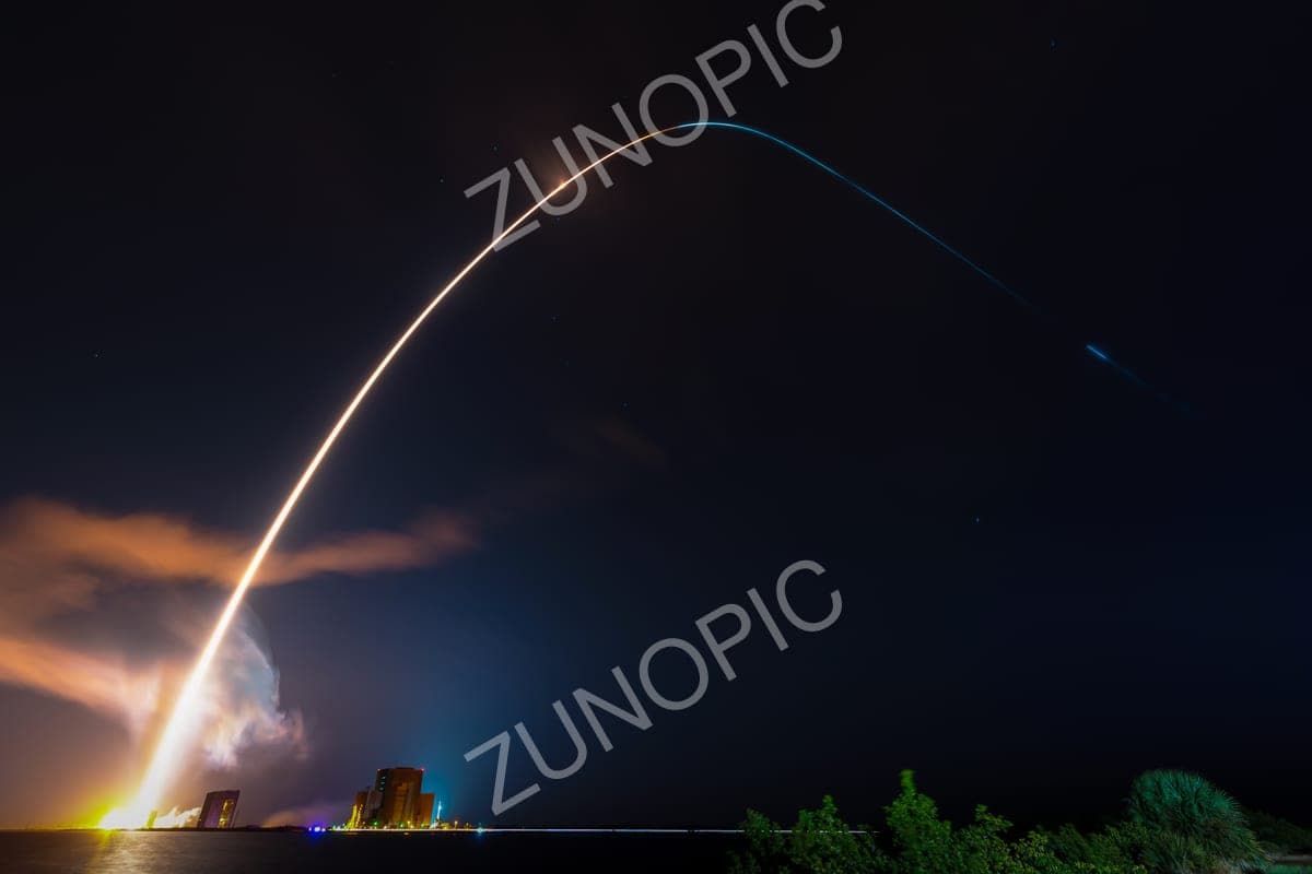 Rocket launch arc in a long-exposure night sky