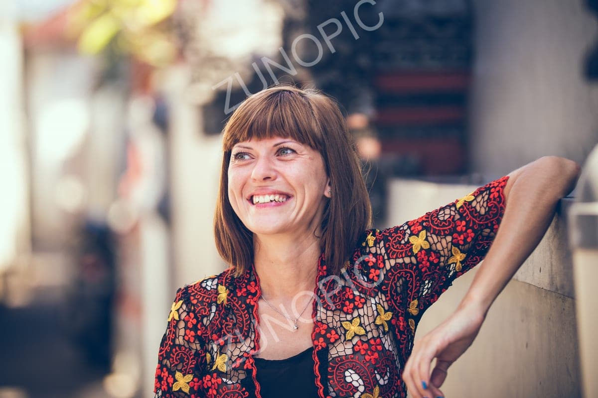 Smiling woman in an embroidered jacket, portrait