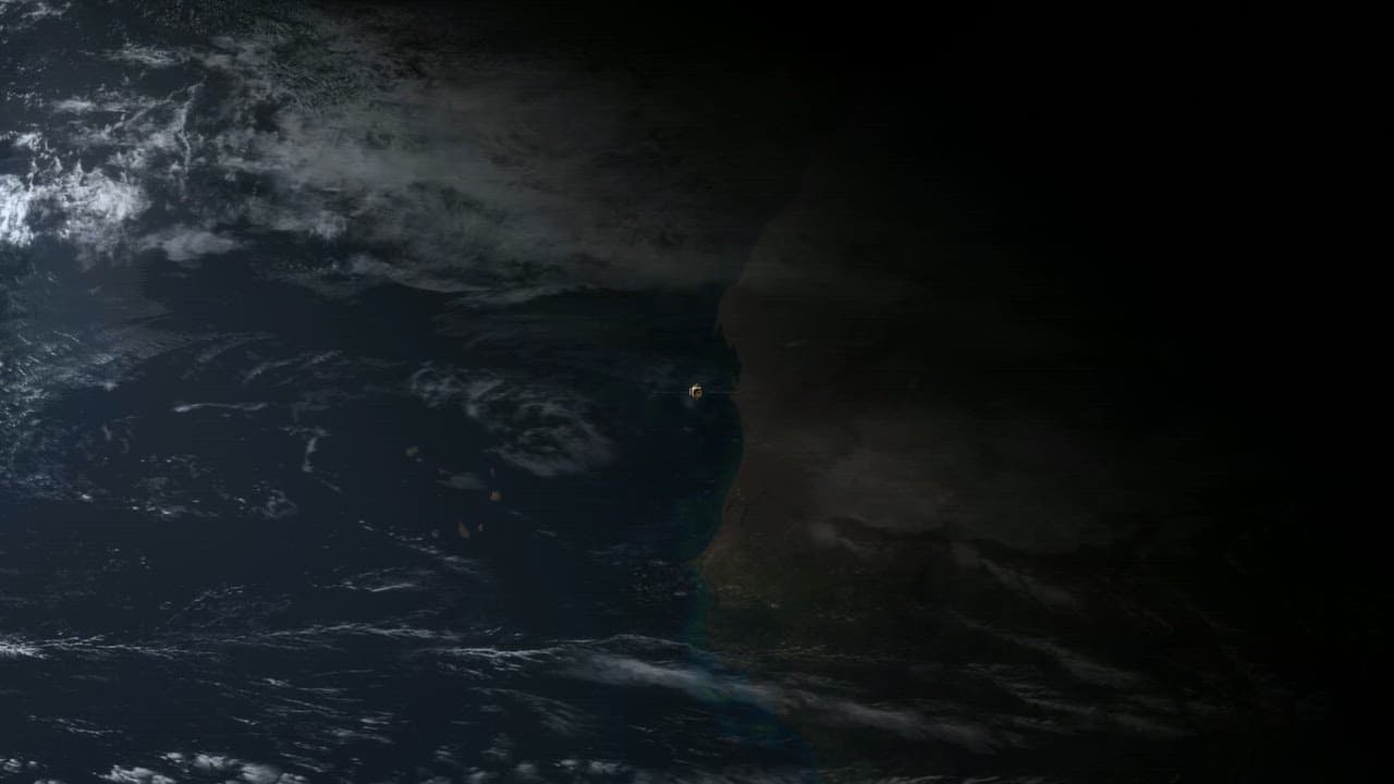 Satellite gliding high over a desert coastline