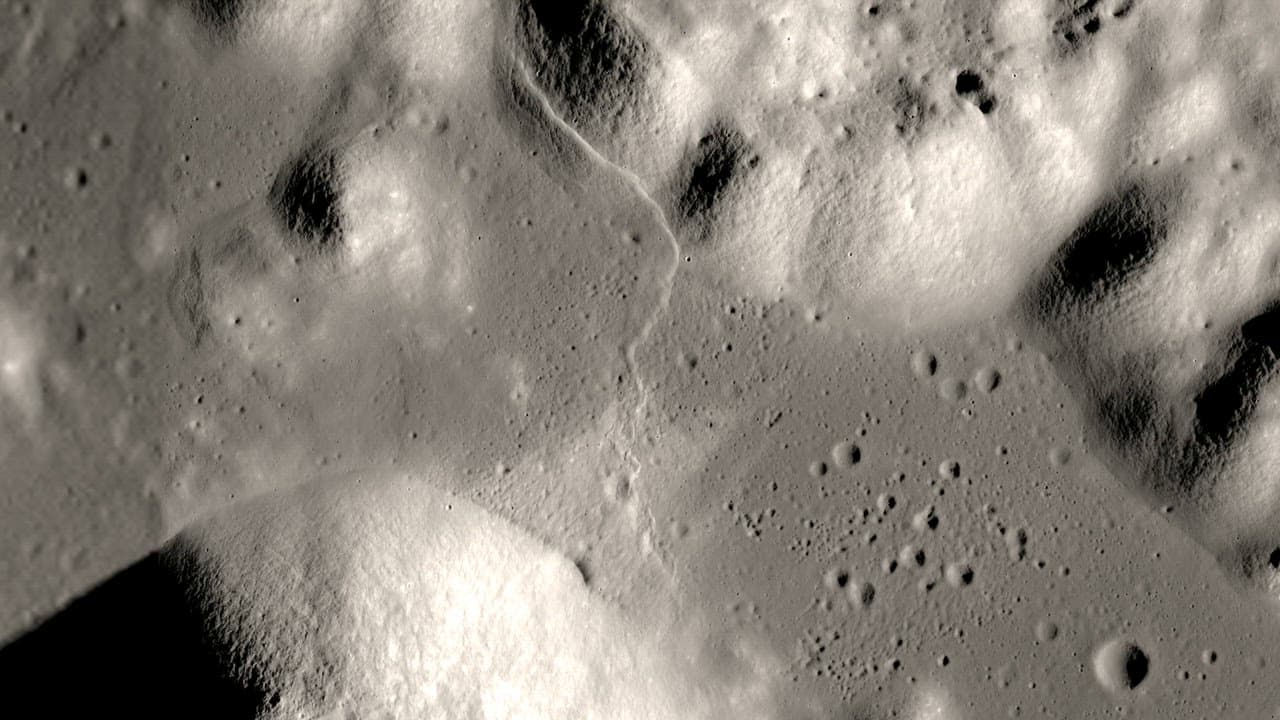 Low flyover across craters and ridges on the Moon